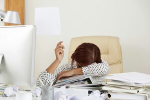 Exhausted Businesswoman Showing White Flag