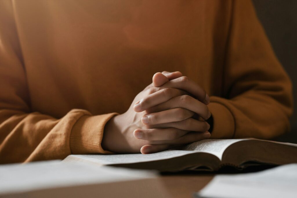 girl praying thanksgiving with holy scriptures God's teachings based on faith and faith